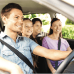 Family driving in car with in-car navigation
