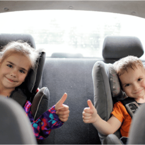 Happy children being entertained in the car