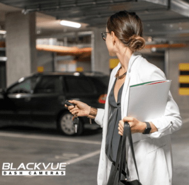 Woman locking car and leaving it in car park protected with BlackVue Dash Camera